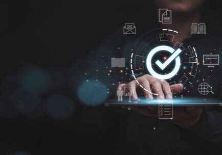 Businessman using laptop with correct sign mark and document icon for online approve  paperless and quality assurance concept.